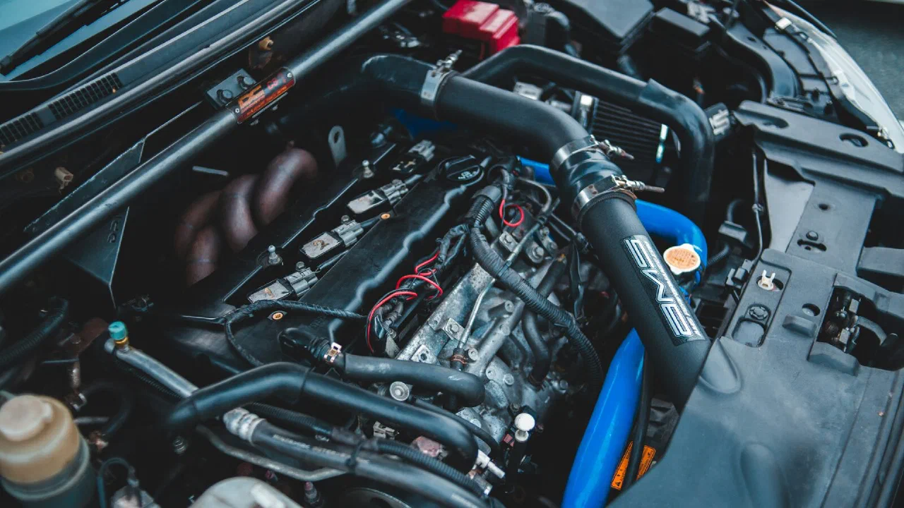 A black and blue car engine bay